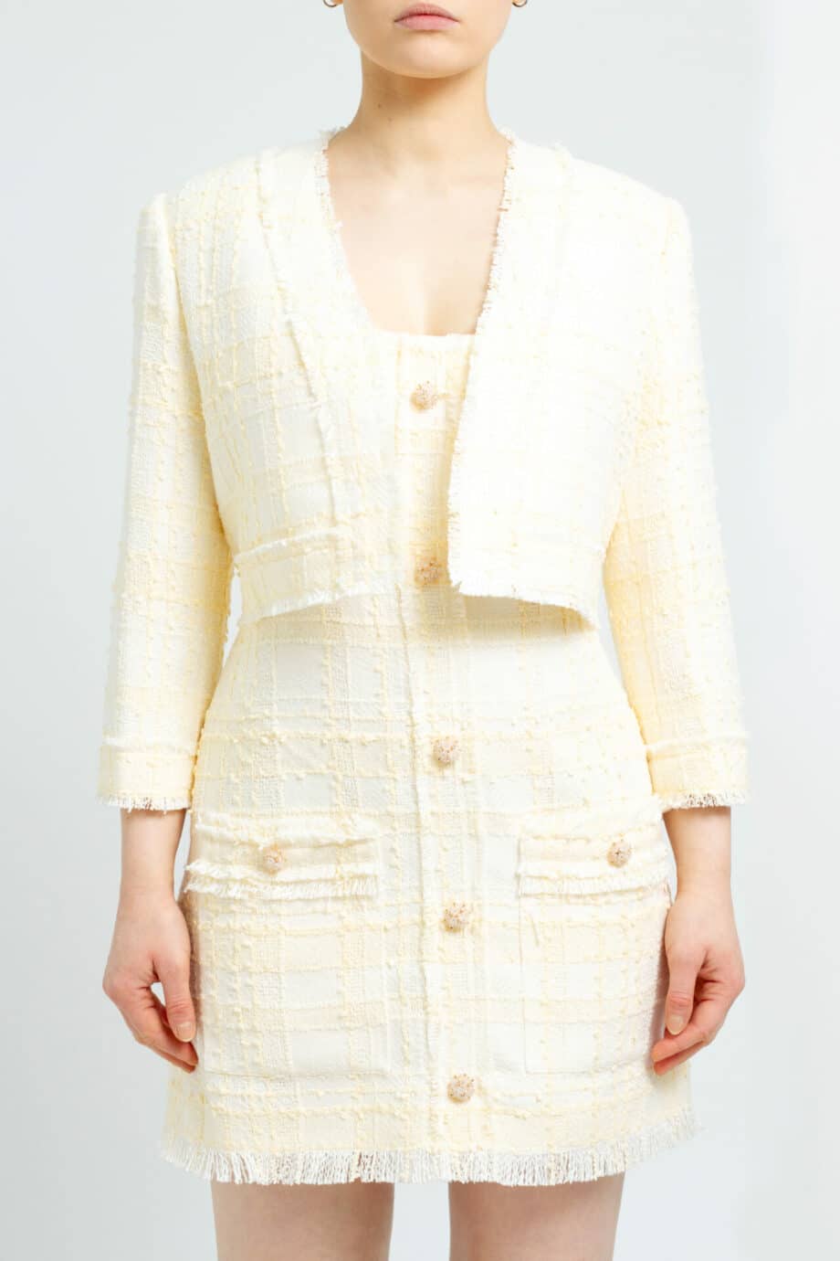 Short, open tweed jacket