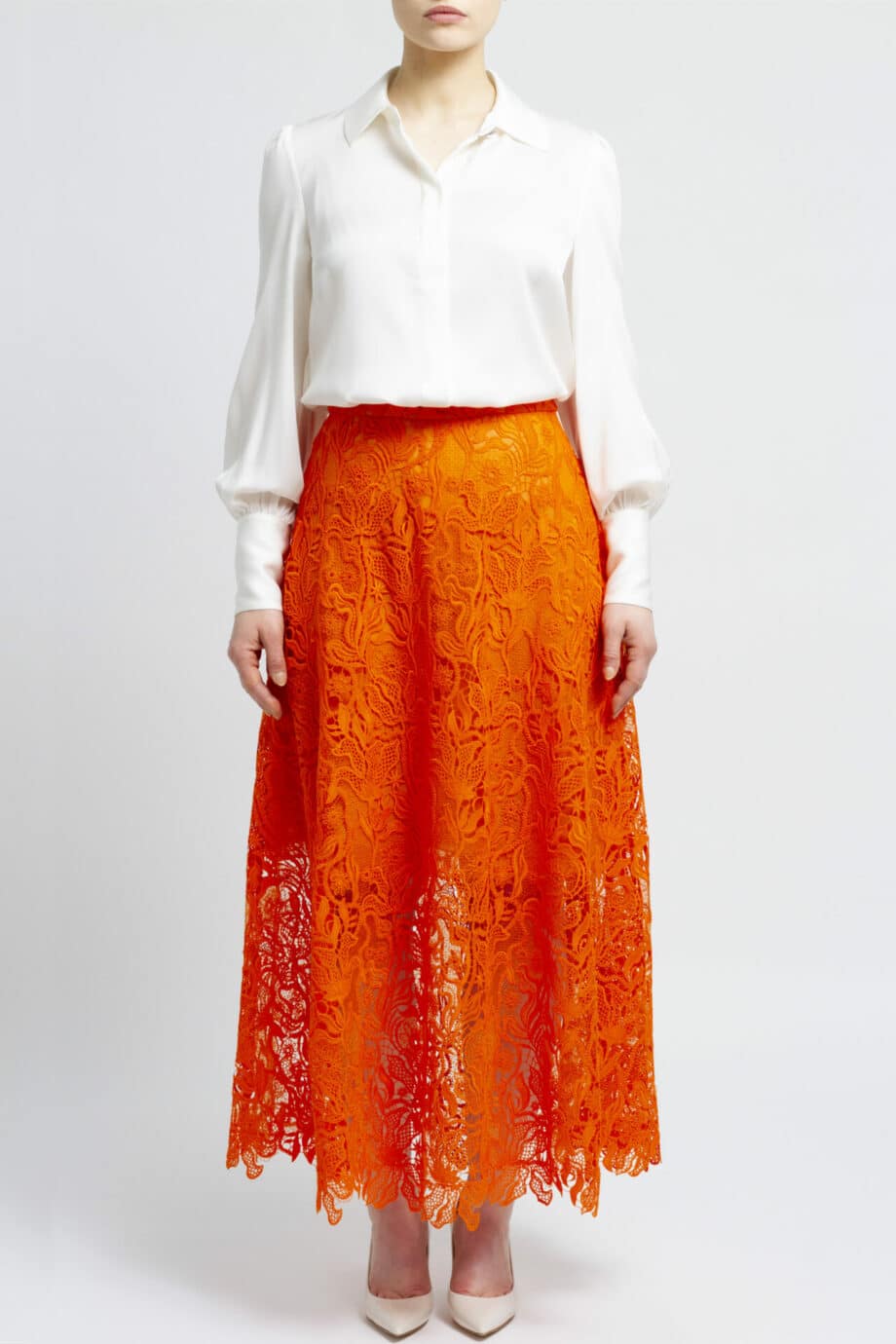 Calf length, flared lace skirt with silk lining